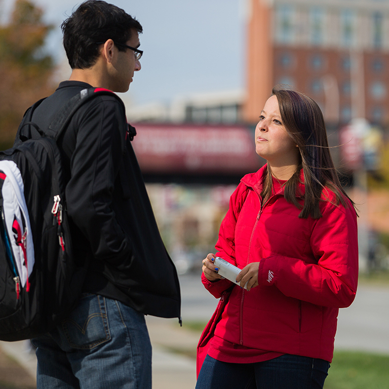 Two students in a conversation.